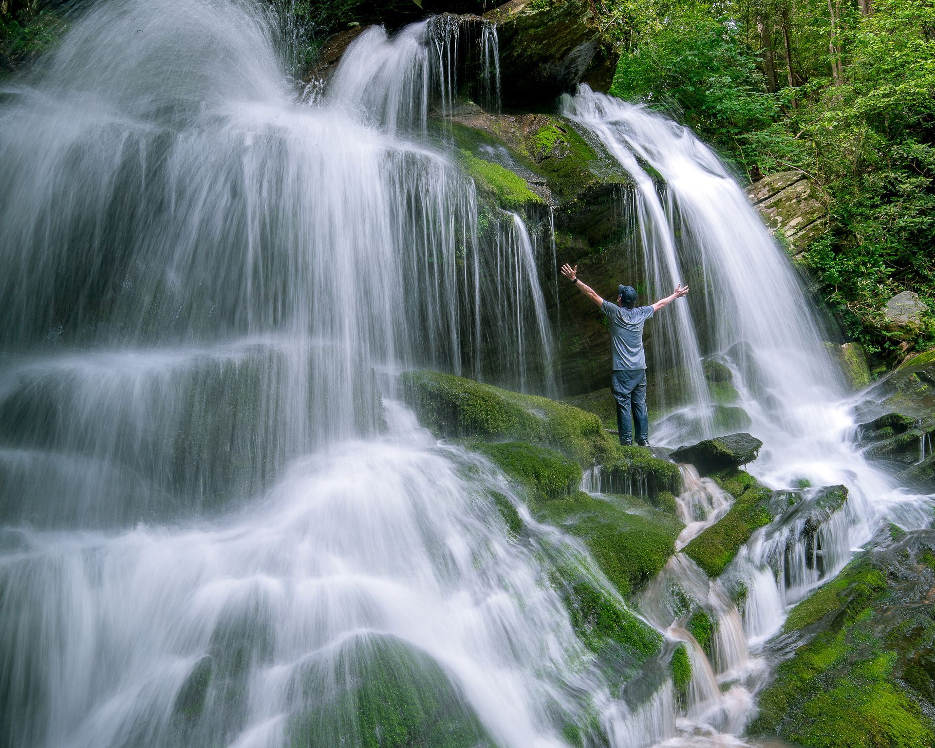 Brad Burgess standing behind a waterfall in North Georgia